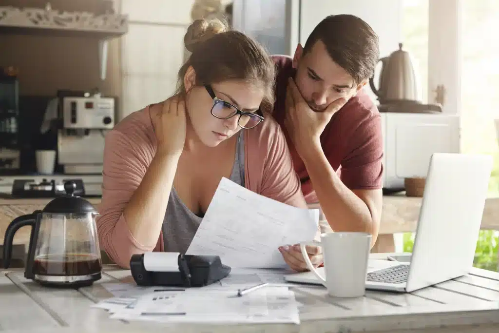 Young Caucasian Family Having Debt Problems Able Pay Out Their Loan Female Glasses Brunette Man Studying Paper Form Bank While Managing Domestic Budget Together Kitchen Interior